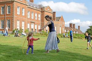 A family taking pleasure in the gardens of the Dudmaston Estate
