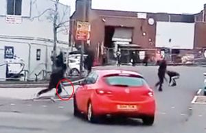 Footage shows the youths running through roads towards each other.