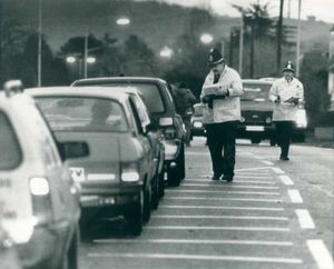 Police question motorists in the village of Hagley in January, 1988
