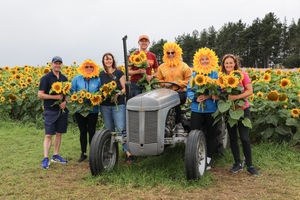 The team from Lingen Davies Cancer Support, Shropshire Petals, and Shropshire Festivals at Shropshire Petal Fields in Newport