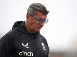 England Women's coach Jon Lewis looks down during a training session.