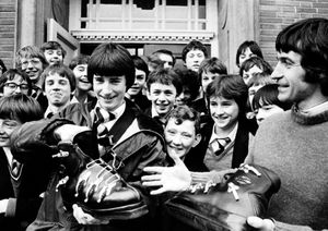 Picture taken at Priory Boys School, Shrewsbury, on February 14, 1980. Caption read: 'Who needs skis when you've got size 12 feet?. This has been the problem for 15-year-old Alistair Davies from Shrewsbury who is one of the party of 30 pupils at Priory Boys School, Shrewsbury, who are off to Italy on a skiing holiday. He couldn't get a pair of ski-boots large enough, but teacher at the school, Mr Granville Stacey, turned up with these giant boots.