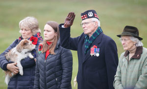 Pre-booked visitors at the National Memorial Arboretum in Alrewas, Staffordshire, observe the 'virtual' Act of Remembrance from the Armed Forces Memorial