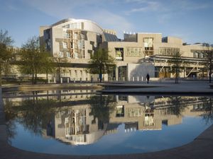 Exterior view of the Scottish Parliament, under blues skies