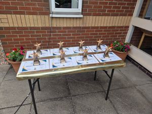 All 12 long serving staff received a certificate and trophy to make the milestone