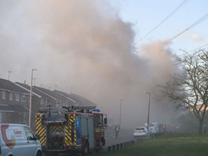 Supporting image for story: Fire service issues update on blaze at business site as building remains 'unsafe'
