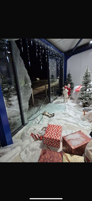 The smashed window and the wrecked display.