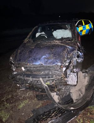 The vehicle crashed into a hedge and a farm building. Picture: Oswestry and Ellesmere Police