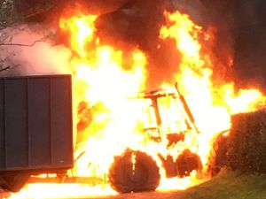 Supporting image for story: Fire guts tractor and spreads to hedgerow bordering country road