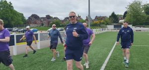 Mike Lomas leads the way during the warm-up drills