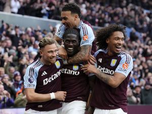 Aston Villa players celebrate after scoring a goal