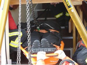 Firefighters training with an overweight mannequin