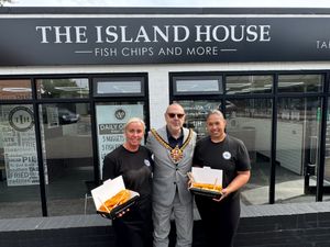Mayor of Wolverhampton, Cllr Craig Collingswood, with staff from the Island House Fish & Chip restaurant 