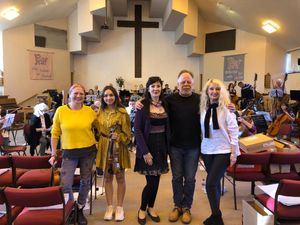 Supporting image for story: Ukrainian musicians' delight as Shrewsbury orchestra share instruments ahead of castle concert