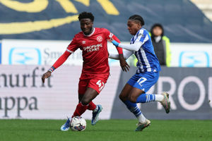 Nohan Kenneh of Shrewsbury Town and Martial Godo of Wigan Athletic (AMA)