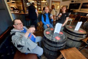 Customers Richard Mills, Pete Mills and Phil Rushton enjoy a drink in The Mill