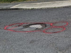 Supporting image for story: ‘Penis potholes’ protest prompts patch-overs