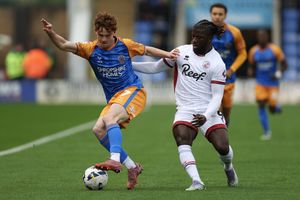 Tommy McDermott of Shrewsbury Town and Kabongo Tshimanga of Crawley Town