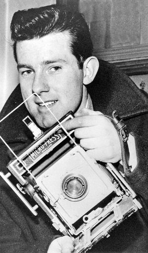 Press photographer Graham Gough with an MPP Press Camera ready for action in 1956