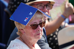 A woman tries to keep cool ahead of the national Service of Remembrance, hosted by the Royal British Legion in partnership with the Government, to mark the 80th Anniversary of VJ Day at the National Memorial Arboretum in Alrewas, Staffordshire. Picture date: Friday August 15, 2025. PA Photo. Photo credit should read: Christopher Furlong/PA Wire 