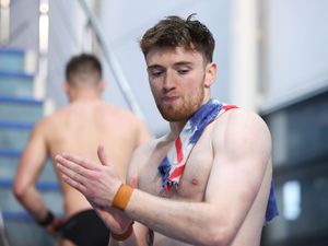 Matty Lee rubs his hands as he competes at the British Diving Championships in 2022