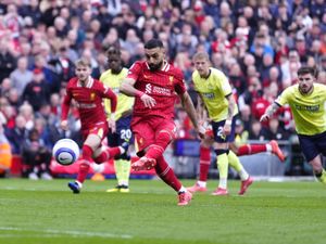 Liverpool’s Mohamed Salah scores their side’s second goal