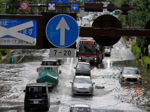 Supporting image for story: Heavy rain floods streets and halts air and rail travel in Tokyo