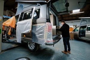 Shop manager Chris Lee prepares one of the campers