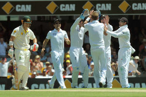 England's Stuart Broad (third right) celebrates taking the wicket of Australia's David Warner (left)