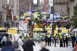 Police and emergency personnel dealing with a road traffic accident on Water Street near the Liver Building in Liverpool after a car collided with pedestrians during the Premier League winners parade.