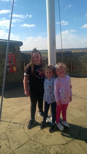 We reached the top! Olivia, Lucy and Annabelle celebrate after climbing more than 500 stairs