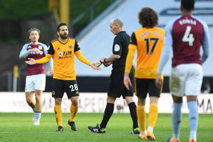 Joao Moutinho of Wolverhampton Wanderers reacts towards Referee Mike Dean after he receives a red card (AMA)