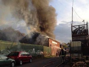 Supporting image for story: Firefighters tackle huge blaze as car business destroyed by fire