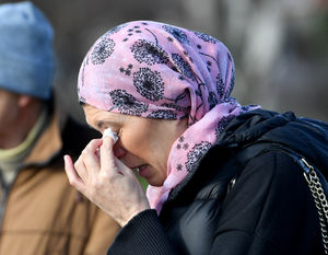 SHREWS COPYRIGHT MNA MEDIA TIM THURSFIELD 19/02/23.Members of the Turkish community gather at the war memorial, at The Quarry, Shrewsbury, to remember the victims of the earthquake..