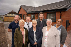 Lincoln Green new council bungalows open day. Back (L-R): Nathan Bayliss, site agent at Keon Homes; George Williams, project manager at Wolverhampton Homes; Councillor Chris Burden, cabinet member for city development, jobs and skills; Teresa Phillips, resident and board member at Wolverhampton Homes; Front L-R: resident Rose Davis; Diane Brookshaw - chair Tenants and Residents Association; Jackie Swift - resident and TRA committee member