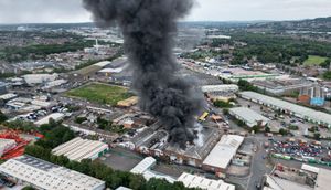 Black smoke pours into the sky from the fire at GB Tyres in West Bromwich. Photo: Tim Thursfield