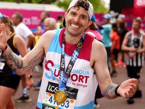 Joel Dommett after crossing the finish line during the TCS London Marathon