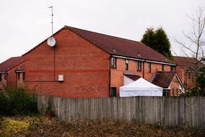 A forensics tent at the property which is the focus of the investigation