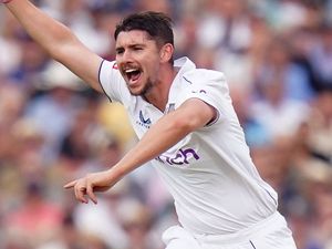 Josh Tongue celebrates a wicket