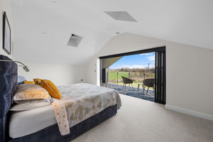 The luxurious master suite with a private, covered balcony.

 