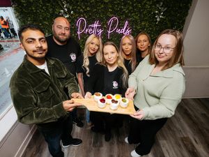 Pretty Puds in Newport is being handed over to new owners. Pictured is Samantha Parker (middle) handing over the business to Akshay Sharma and Katie Sharma