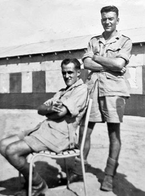 Roy, standing, with a colleague.