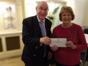 Rotary Past President John Winter handing over donation to ODA Gill Worrell-Arnold