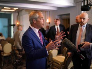 Reform UK leader Nigel Farage speaking to the media after a press conference in Dover in Kent