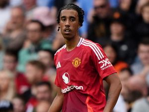 Supporting image for story: Manchester United defender Leny Yoro seen on crutches with left foot injury