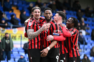 Jamille Matt thanks Aden Flint for the assist after scoring Walsall's third.