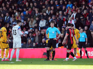 Referee Sam Barrott waits on the VAR decision before they rule out a second goal for Bournemouth during the Emirates FA Cup fifth round match at the Vitality Stadium