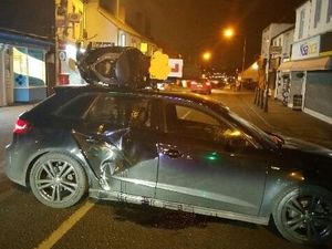 Supporting image for story: Motorbike ends up on top of car after crash on Black Country high street