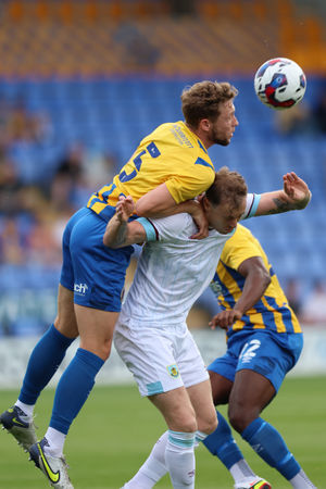 Matthew Pennington of Shrewsbury Town and Ashley Barnes of Burnley (AMA)