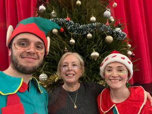 Town clerk Louise Hammond, centre, with two of Santa's elves at the Christmas event